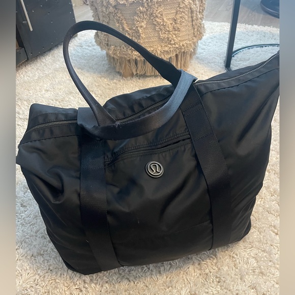 lululemon athletica Handbags - Lululemon large black duffel gym bag travel bag